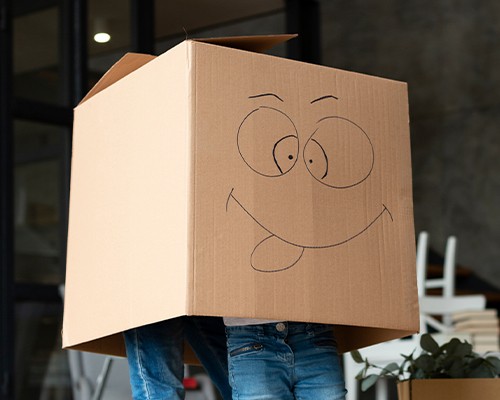 Moving crew carrying protected furniture